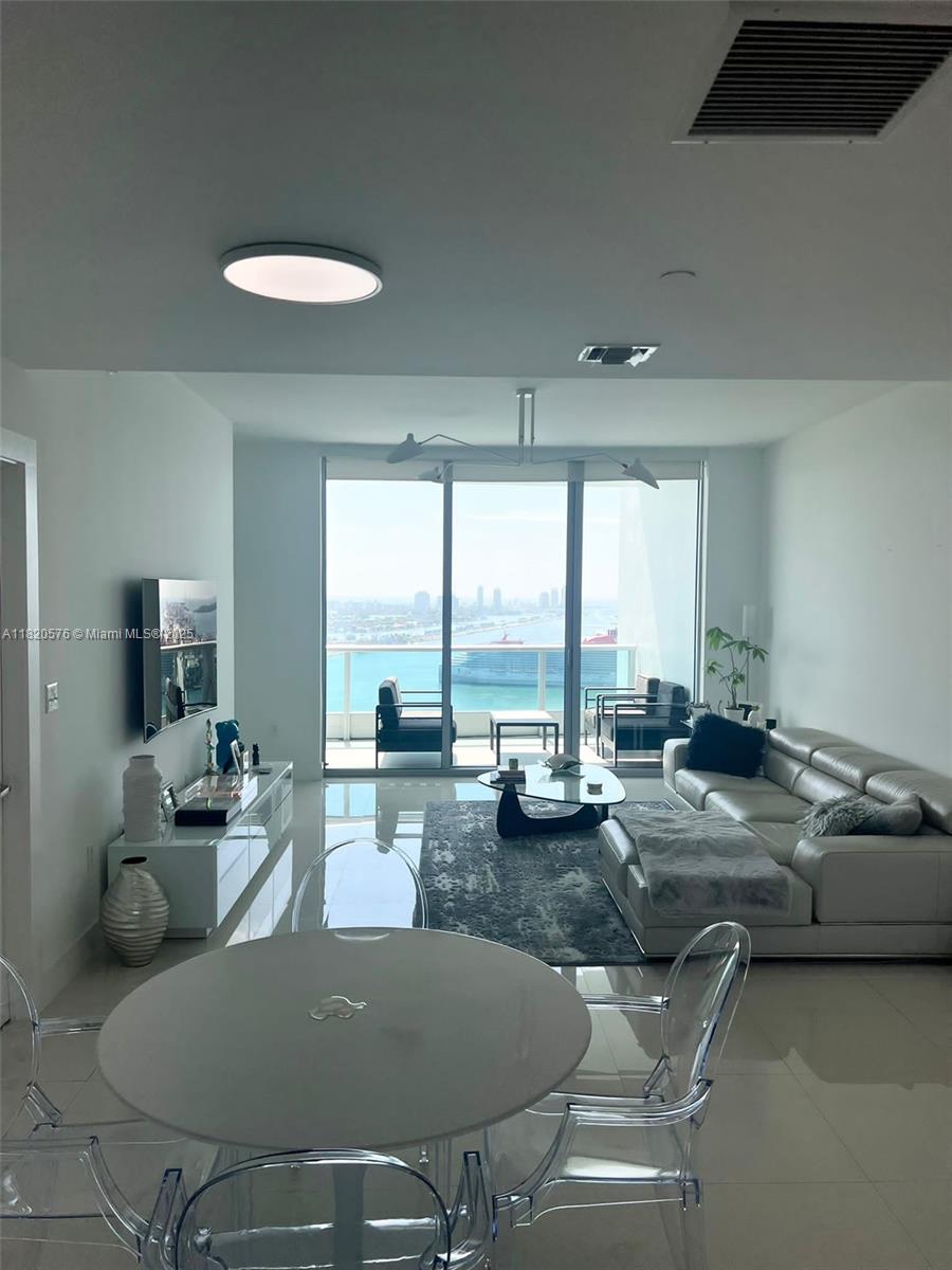 Spectacular unit with private entrance to elegant foyer to double door that takes you to this magnificent 2
bedroom, 3 full baths also a den with own full bath and balcony overlooking west. Rented unfurnished giving your
clients the option to furnish and decorate it. Unobstructed Biscayne Bay views to the East and skyline views to the
West. Marble countertops and ceramic tile throughout. Top of the line appliances, California closets, a dedicated
laundry room that takes you to service door and a/c, water heater closet. Resort style amenities and services with
2 pools, BBQ area, Spa room, gym, kids room, library/clubroom and movie theater. Walking distance to parks,
museums, Arscht Center, Miami World Center and all forms of transportation.