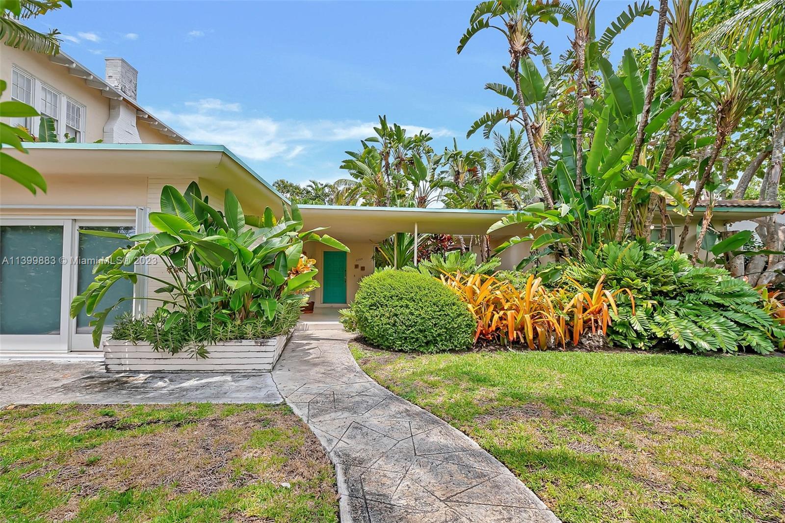 Charming 3 bdrm/ 2 bath home with mid-century modern vibes on Miami Beach. Loads of potential, remodel or build. Lovely courtyard entry. Open concept living/dining/family room with bar. Kitchen features white cabinetry, space for a breakfast table. Split bedroom plan with private primary suite. Two guest bedrooms off the living area. Tropically landscaped backyard with patio, fruit trees, shed. Just down the street from the Miami Beach Golf Club, minutes to the best restaurants, nightlife and beach. Mostly impact windows.