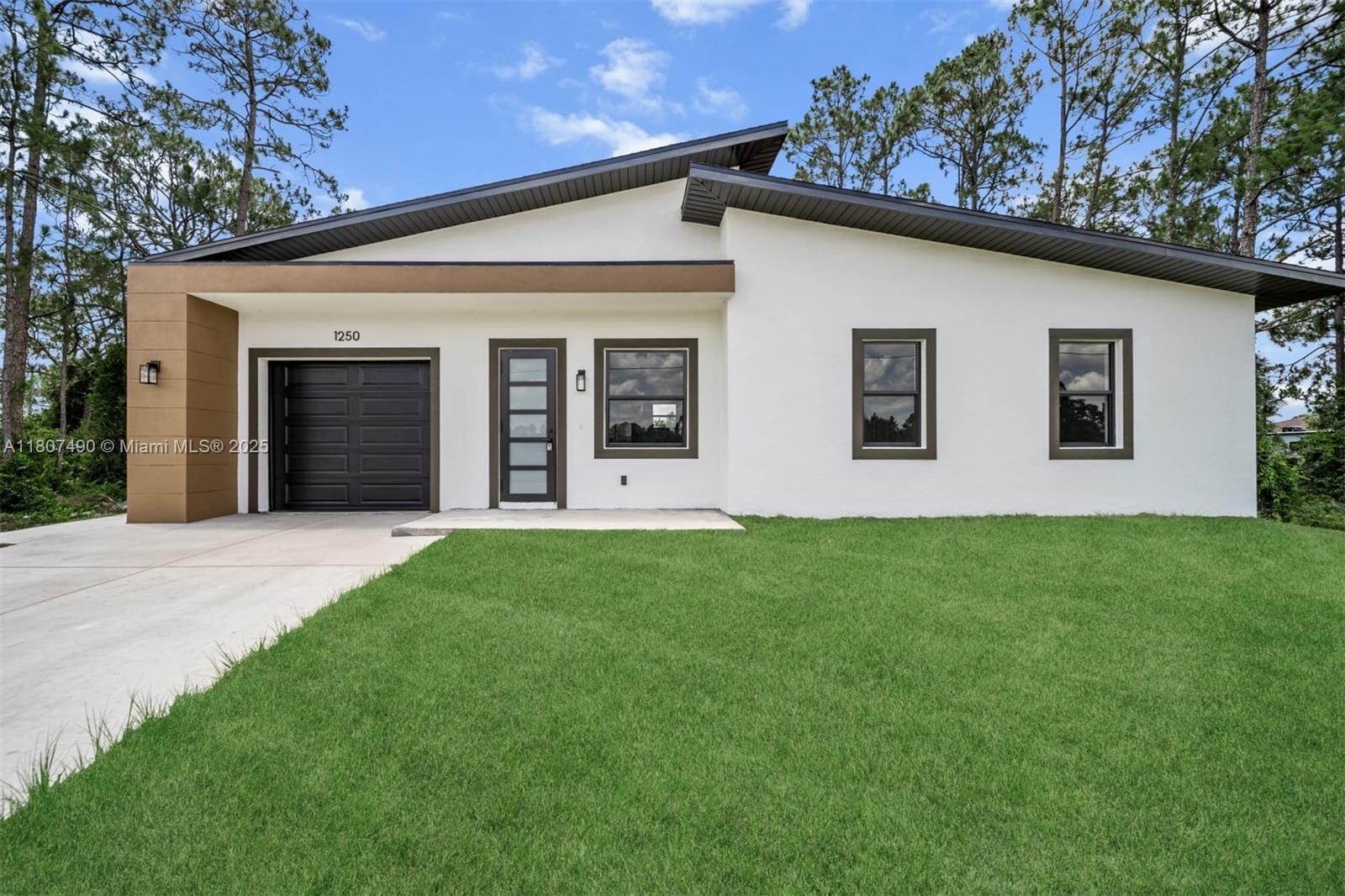 Property for Sale at 1250 Echard St E St, Lehigh Acres, Lee County, Florida - Bedrooms: 3 
Bathrooms: 3  - $315,000