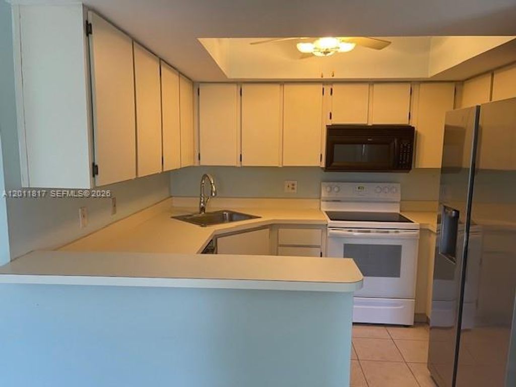 Photo of 4355 Village Dr #A, Delray Beach, FL 33445 (MLS # A12011817)
