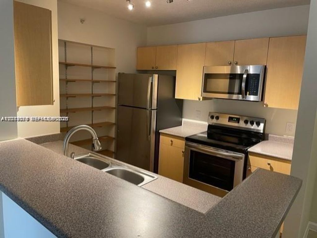 Photo of 1900 Van Buren St #220B, Hollywood, FL 33020 (MLS # A12013070)
