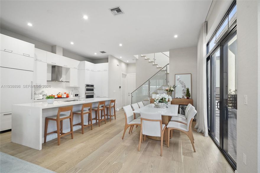 Modern elegance meets everyday comfort in this stunning 4-bedroom, 3.5-bath multi-level residence located in one of Doral’s most desirable communities. Flooded with natural light, this home features an open-concept layout with soaring ceilings, wide-plank wood flooring, and sleek contemporary finishes throughout. The chef’s kitchen is the heart of the home, showcasing custom cabinetry, quartz countertops, high-end stainless steel appliances, and an oversized island ideal for entertaining and casual dining. The seamless flow connects the kitchen, dining, and living areas, creating a bright and inviting space perfect for gatherings. All bedrooms are generously sized, each with its own full bathroom, offering privacy and comfort. The spacious primary suite features a spa-inspired bath, while the additional bedrooms are ideal for guests, a home office, or family use. A convenient half bath enhances functionality for entertaining. Enjoy outdoor living with a private patio perfect for relaxing or hosting. Additional features include a private garage, modern stair design, ample storage, and a dedicated laundry room. Situated in a well-planned neighborhood close to top-rated schools, parks, shopping, dining, and major highways. Residents enjoy exclusive access to the Canarias resort-style clubhouse, featuring a state-of-the-art fitness center, pool, spa, and thoughtfully curated lifestyle amenities.