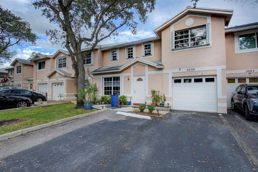 Rare SPACIOUS beautiful townhouse sitting on a lovely waterfront lot. Remodeled + upgrades throughout with high volume ceilings! 3 bedrooms upstairs PLUS 4th bedroom that can be reconverted on first floor. One full bathroom downstairs and two full bathrooms upstairs. Wonderful kitchen with stainless steel appliances and water views. New flooring throughout! One car garage! Home generator set up! Amazing backyard with large screened patio and waterfront views! Very desirable location in Cooper City. A+ schools and close to major transportation, shopping +restaurants!