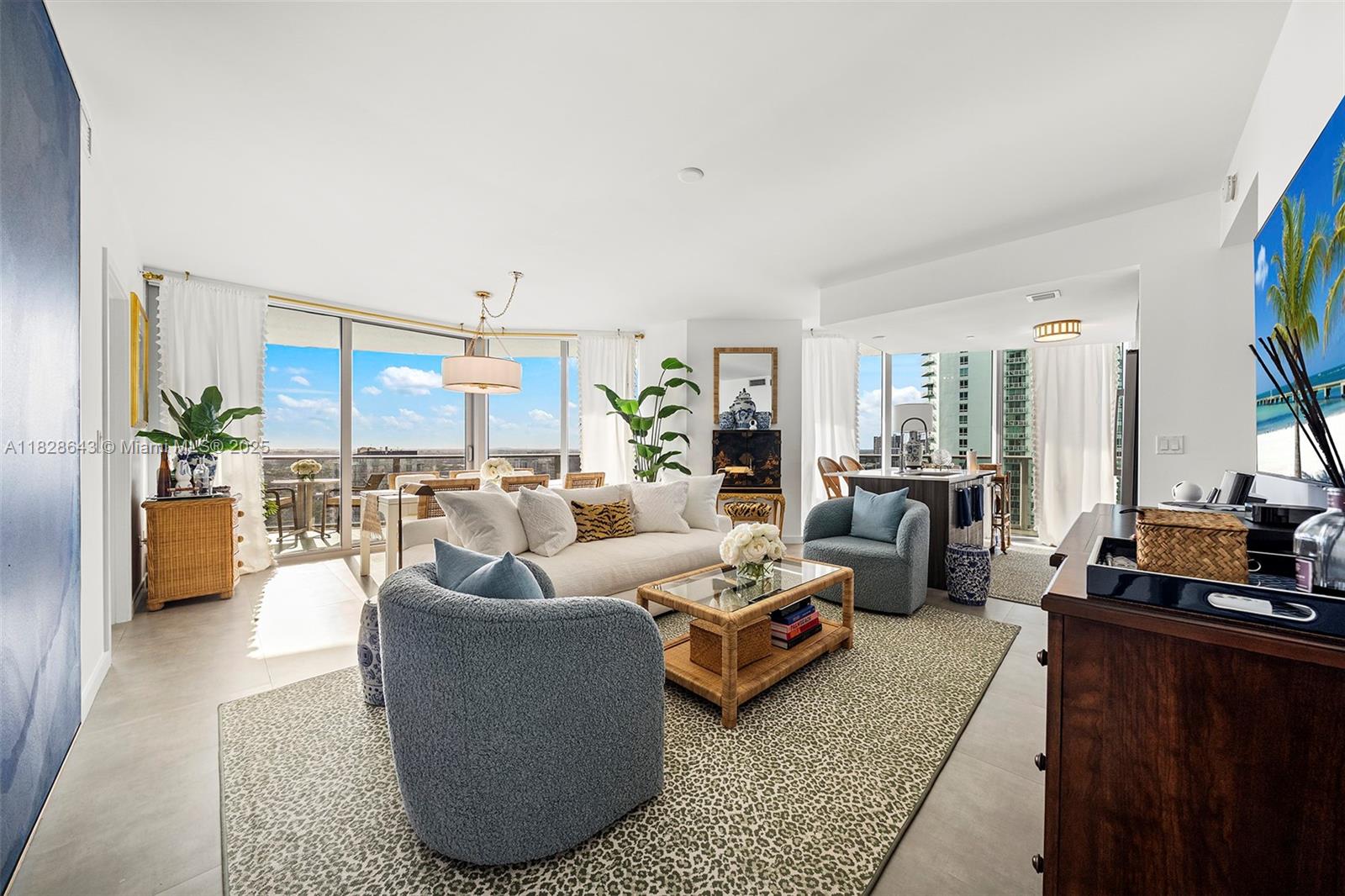 This exceptional 2-bed, 2.5-bath corner condo offers breathtaking skyline views through 9-ft floor-to-ceiling windows and a 300+ sq. ft. wraparound balcony, perfect for sunset views. The open layout flows seamlessly between living, dining, and entertaining spaces, while the European kitchen features quartz countertops and Bosch appliances. Both suites boast custom walk-in closets and blackout shades. Recent upgrades include new appliances, window coverings. Aria on the Bay offers resort-style amenities, including three pools, a fitness center, spa, and theater. Located in Edgewater, minutes from Wynwood and the Design District. For a seamless move-in experience, it is available fully furnished. Available for immediate occupancy.