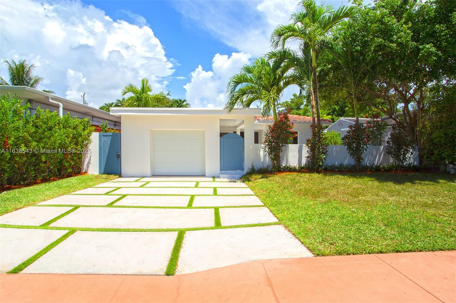 Impeccably renovated single-family home designed for modern living. Enjoy this thoughtfully designed space featuring 3 spacious bedrooms and 2 elegantly appointed bathrooms, including a luxurious rainfall walk-in shower and dual sinks. The open-plan kitchen dazzles with quartz countertops, a central island, and stainless steel appliances, inviting gatherings with family and friends, while sliding glass doors flood the space with natural light. Outside, relax on your private porch and patio, or enjoy the low-maintenance artificial lawn and pavers. Additional highlights include AC unit, an advanced alarm system, attached garage, new roof, new impact windows and doors, new garage door. Just 0.4 miles from Normandy Isle Park & Pool, near Normandy Fountain’s vibrant restaurants.