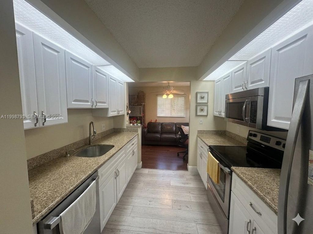 Photo of 1600 SW 127th Way #101C, Pembroke Pines, FL 33027 (MLS # A11998793)