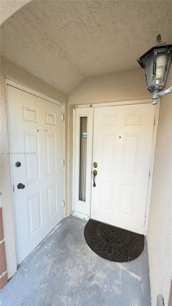 Venetia Gardens South is a beautiful condominium built in 2004. The community is gated with a pool and a beautiful lake inside. It is easily accessible via roads and the Turnpike. The unit is in good condition and very light and clear during the day. It has one assigned parking space in front of the unit. Small yard in the back. Washer and dryer inside. Plenty of extra parking space is available. It has a storage space at the entrance of the apartment which contains the hurricane shutters. Appointment needed.