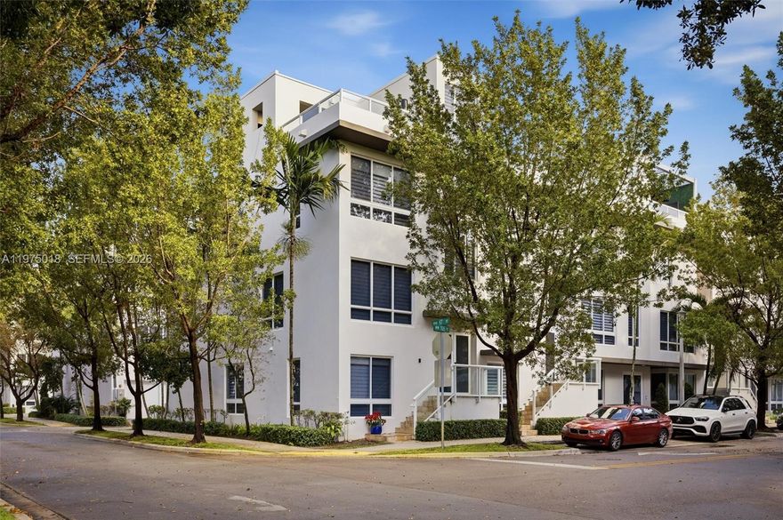 Stunning four-level corner townhouse in the heart of Doral. This exceptional residence features 4 bedrooms, 3 full bathrooms and 2 half bathrooms, offering both space and sophistication. The top floor showcases a spectacular rooftop terrace complete with a BBQ, refrigerator, and dishwasher—perfect for enjoying open-sky views and unforgettable sunsets. The home boasts soaring ceilings, impact windows and doors, a private elevator, and a sleek modern kitchen with stainless steel appliances and quartz countertops.