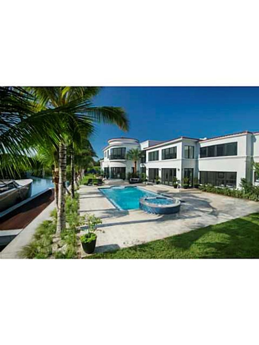 INCREDIBLE OPPORTUNITY! This exquisitely built home feels like a private estate with an impressive water frontage of 300'.Two minute walk from the ocean,Faena District, Edition Hotel, & top restaurants. This 6700 sq ft home offers 6BR/7.5BA, gourmet/koshe r kitchen, staff quarters, grand formal rooms, & a GIGANTIC master bedroom - featuring 13' ceilings, private office, 2 balconies, walk in closet, & jacuzzi. Separate guest home offers master suite & gym. Resort style pool, infinity hot tub, private dock.