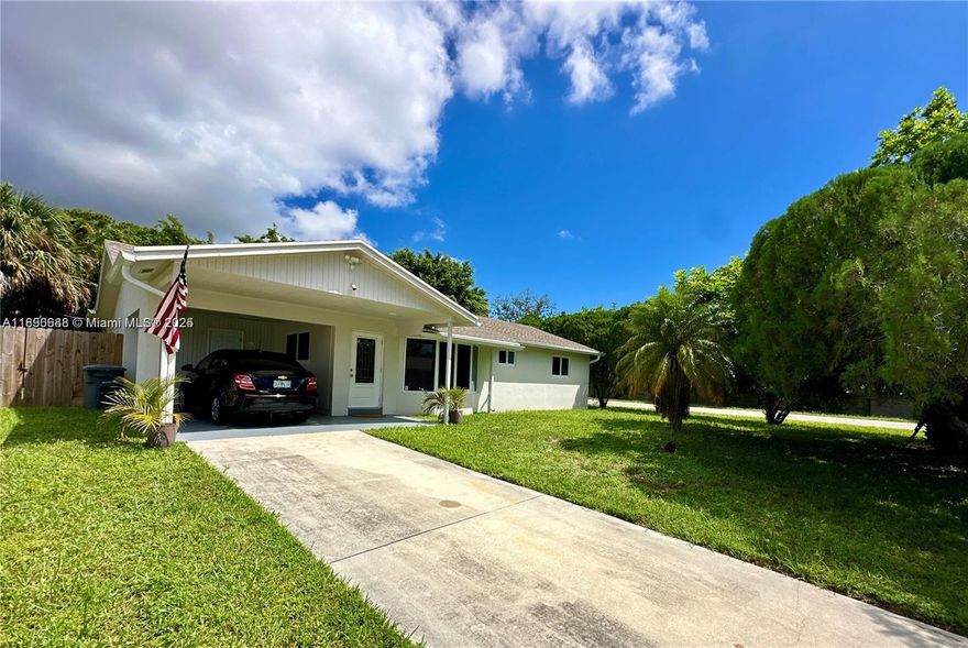 Renovated 3-bedroom2-bathroom corner home in a quiet neighborhood of Boynton Beach. Fully furnished, the property boasts a spacious fenced backyard and a charming screened-in patio, creating the ideal setting for outdoor entertainment and relaxation. The home's interior features impact windows, tiles throughout, an open kitchen with quartz countertops and stainless-steel appliances, and remodeled bathrooms. Additional conveniences include a utility room equipped with a washer and dryer, and a well-water softening system. Two flat-screen televisions are included with the tastefully selected furnishings. Plenty of parking space with a covered carport and a driveway. No HOA approval needed. Great location next to Boynton Beach Mall, minutes from I-95, and just a 3.7 mile drive to the beach.