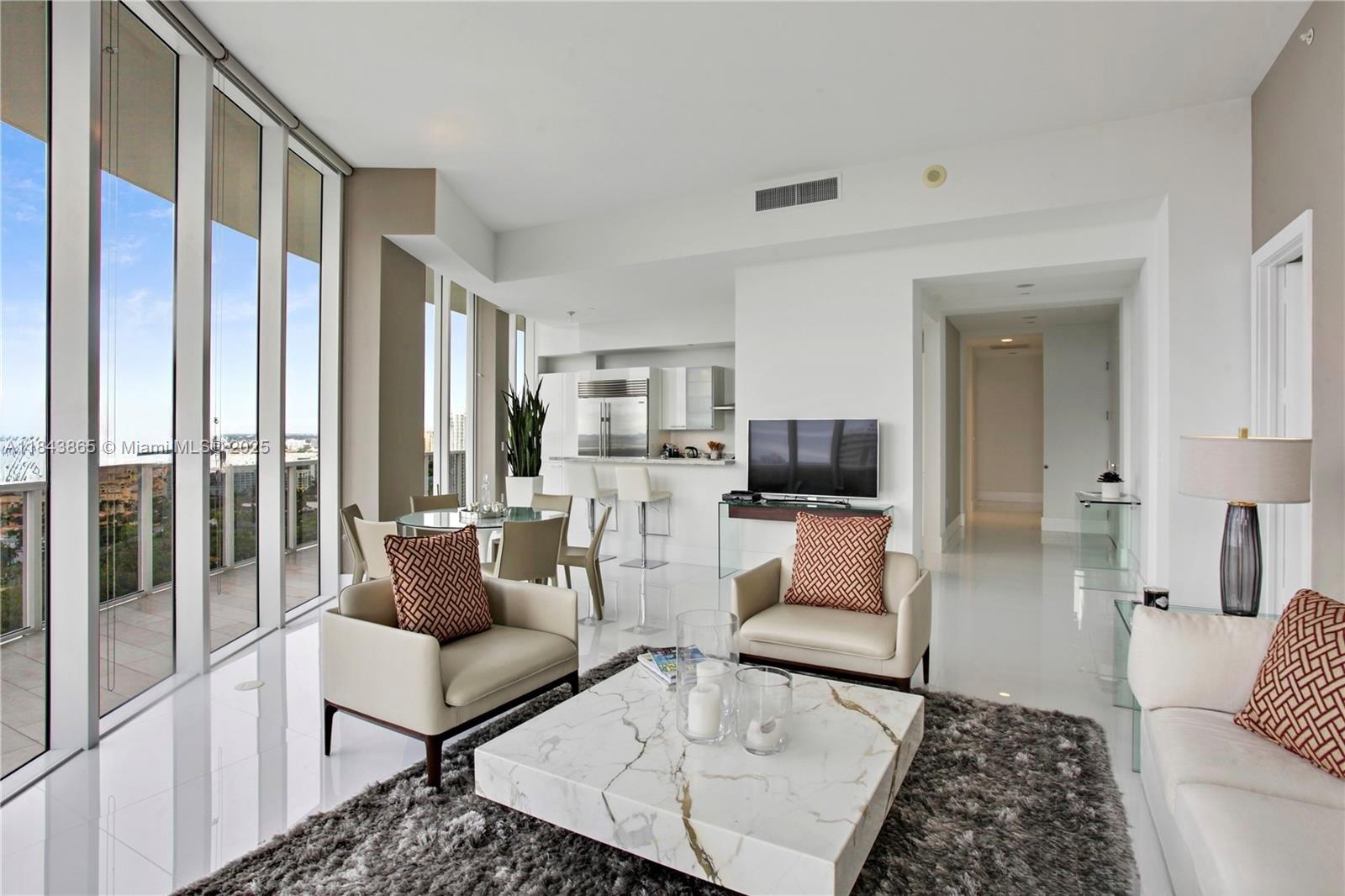 Amazing unit with 12 foot ceilings! This 3 bedroom 3 bath unit has a large wrap around balcony with water, bay, club and garden views. Kitchen has Miele appliances and sub zero refrigerator.Primary bedroom has a walk-in and line closet and large bathroom with jacuzzi tub, separate shower and dual sinks. Laundry room has a convenience sink. Tastefully furnished, this was a model unit for the developer. Main clubhouse is very close and the second clubhouse is across the building. Williams Island amenities galore, 15 tennis courts, 4 pickleball courts, 3 restaurants, spa, marinas, courtesy bus, walking path, kids playground. Storage included.