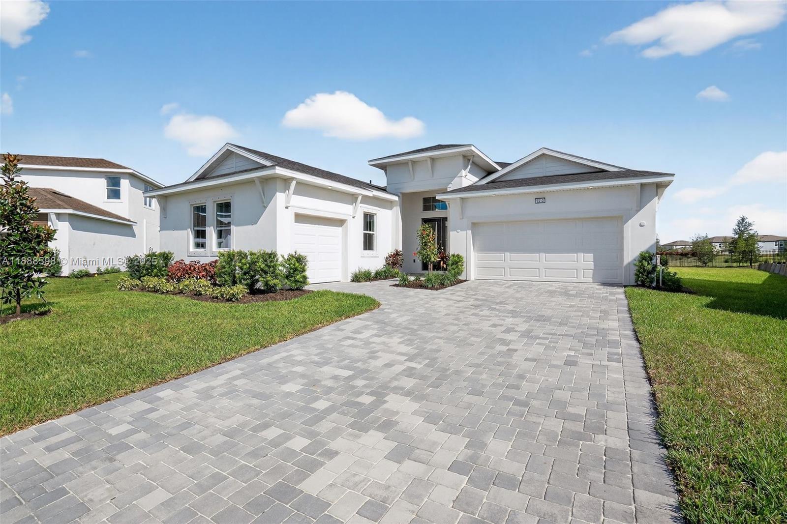 Be the first to occupy this brand new incredible 3 bed 2.5 bath home on a 15,000 sq ft cul-de-sac lot with direct pond frontage. A stunning foyer with 12’ ceilings welcome you, opening up to a generously sized great room with tray ceiling feature and 16’ glass sliders leading to a paver lanai with summer kitchen pre-wire. An oversized gourmet kitchen with expansive island and luxurious flat paneled cabinetry flows into a charming morning kitchen and incredible walk-in pantry. The master retreat showcases a generously appointed Roman Shower with dual shower heads. Additional features include: 10’ ceilings, upgraded 9” beveled White Oak LVP floors, 8’ doors and wall mounted TV outlets. With all comparable lots already sold, this is the sole opportunity available at this price point.