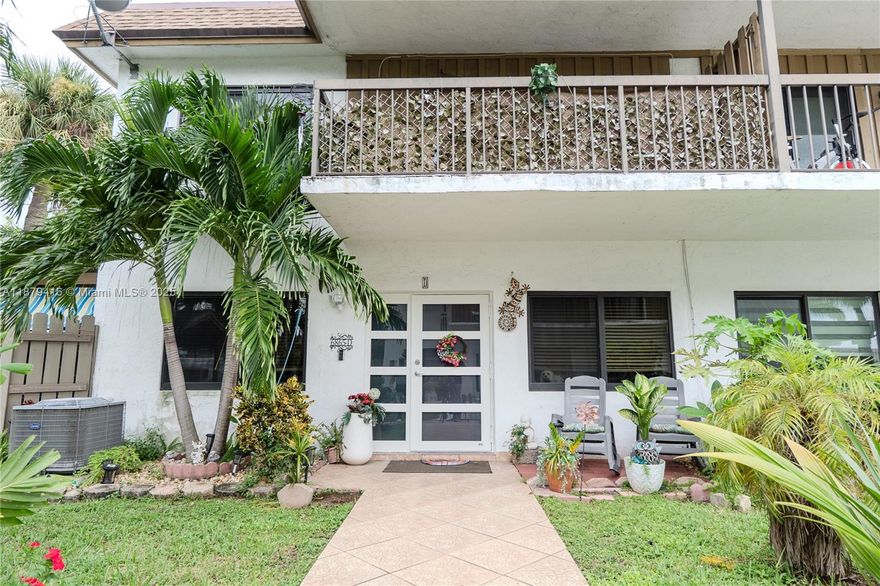 Beautiful 2/2.5 corner townhouse with all impact windows and doors. Spacious open layout with a functional kitchen featuring quartz countertops, wood cabinetry, and stainless steel appliances. Covered patio perfect for outdoor dining and gatherings. Upstairs, two large bedrooms each with their own bath; the primary offers a walk-in closet and private balcony. Includes two assigned parking spaces. Community amenities feature a pool overlooking the lake and tennis courts. Centrally located near shopping, dining, and major highways—ready for you to call home!