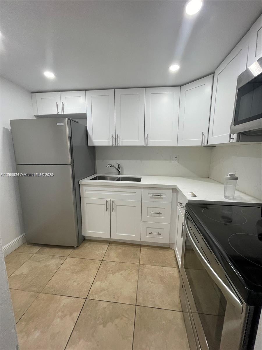 This beautiful second-floor condo features two bedrooms and one bathroom, as well as stainless steel appliances and impact-resistant windows. Ideally situated in the Village of Pinecrest, it is a short distance from Dadeland Mall, US-1, and the Metrorail station. The gated community includes a pool, guest parking, and laundry facilities. The unit comes with one assigned parking space.