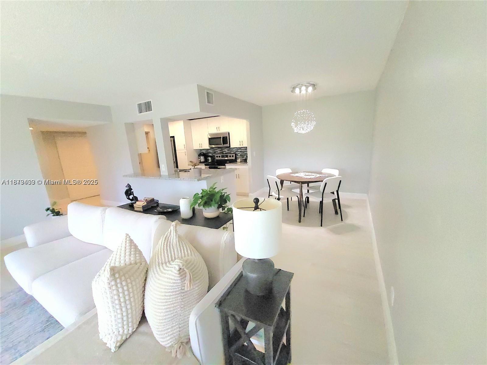 Completely remodeled 2 bedrooms/2 bath in Environ at Lauderhill!! New modern kitchen cabinets, granite countertops with a lovely breakfast bar, and stainless-steel appliances. Remodeled bathrooms, porcelain tiles throughout, large balcony overlooking greenery. Beautifully maintained community surrounded by the Inverrary Golf communities at the cultural center - pool, tennis, pickleball and basketball, bowling, arts & crafts, yoga, fitness gym, sauna and steam rooms, shuffleboard, barbecue area, Internet & water included.