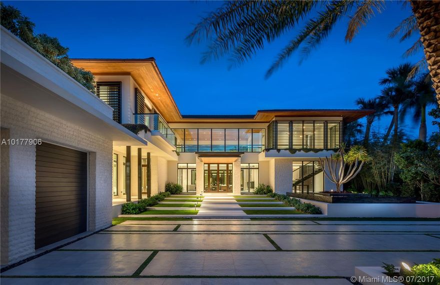 This 9 bed, 10.5 bath limestone estate is the latest edition to Pine Tree Drive. Designed with elegance by Cesar Molina, furnishings include Holly Hunt & Christian Liagre, carefully selected wall treatments, millwork & exquisite textiles by Holly Hunt. The residence embodies a refreshing emphasis on the value of meditation with Curmaru wood overhangs and mahogany windows & doors. The tropical modern design blends interiors and exteriors with an expansive courtyard in addition to a two level gazebo with a full kitchen, bathroom, outdoor shower & fireplace.