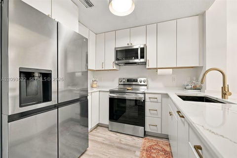 Photo of 8531 NW 139th Ter #1406, Miami Lakes, FL 33016 (MLS # A12093622)