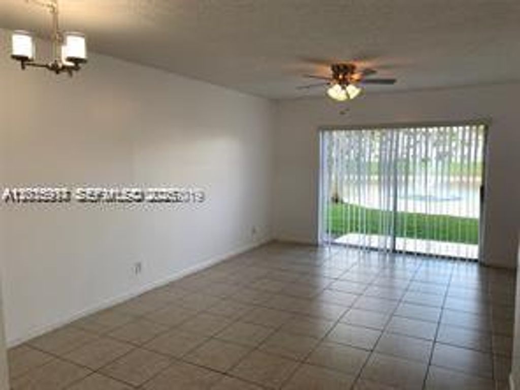 Photo of 895 Twin Lakes Dr #1-F, Coral Springs, FL 33071 (MLS # A12015917)