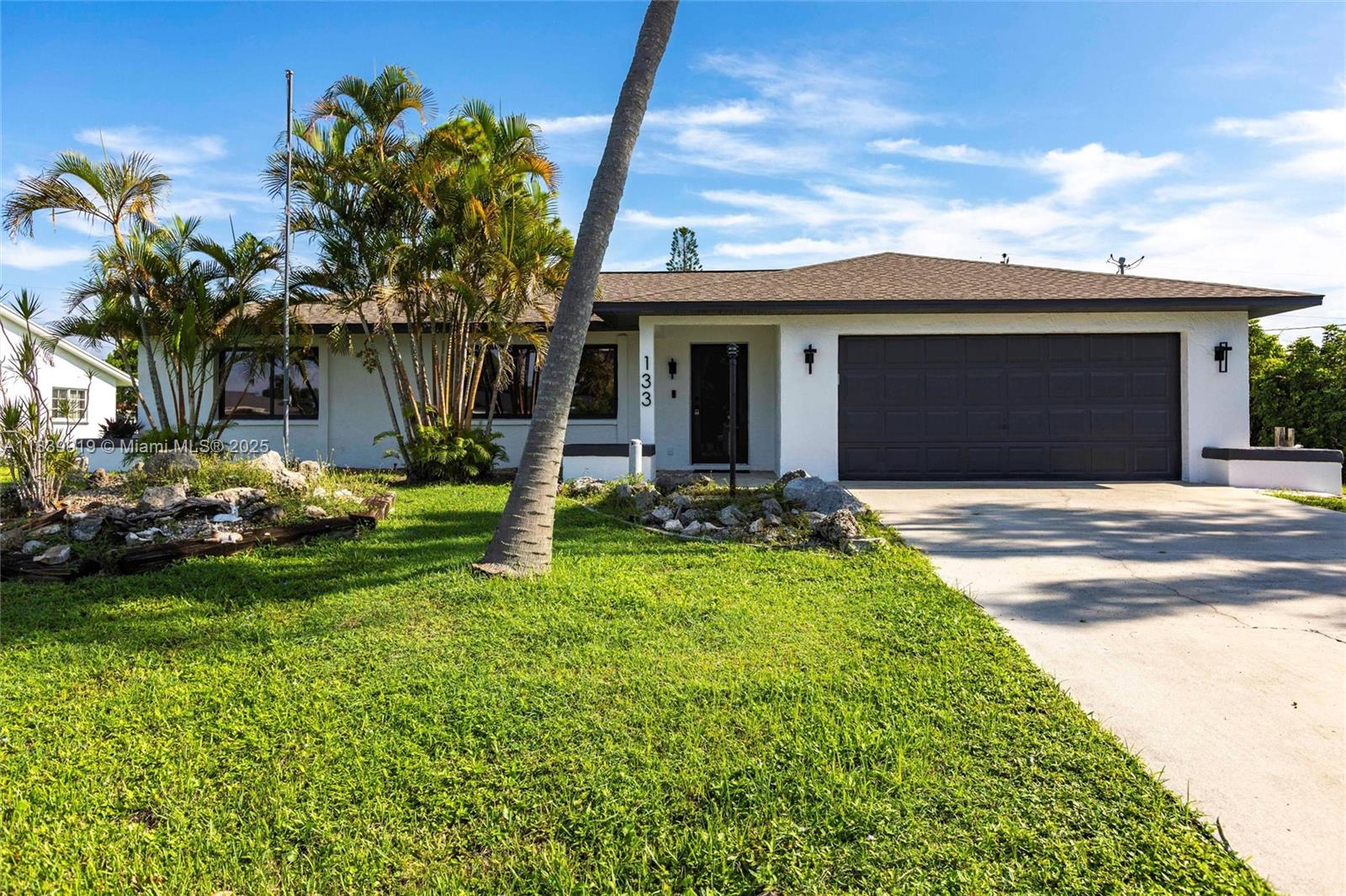 Here's your chance for a fully move in ready home. 24x48 matte porcelain tile throughout this home sitting on a 10,000 sqft plus lot. Brand new Bronze impact tinted windows and doors. Feel secure with the brand new architectural shingles roof that was installed. This is a modern layout with tons of modern finishes; such as Quartz countertops in the kitchen and bathrooms, as well. Black stainless steel appliances and full size washer and dryer hook up area. Plus a large screen enclosed lanai leading to a fenced in back yard.