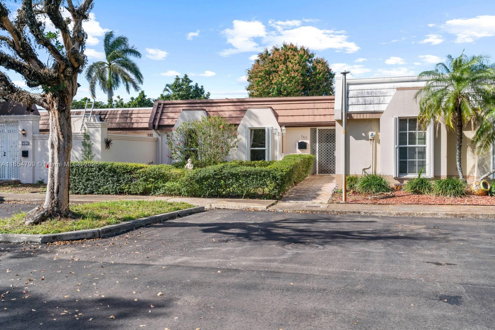FHA! VA! Charming 3-bed, 2-bath townhouse in the heart of Miami Lakes—just minutes from Main Street, Starbucks, Publix, and more! Enjoy a spacious patio perfect for summer BBQs and entertaining. Inside, enjoy an open-concept living space, a fully equipped kitchen with a gas stove, new microwave, and a fairly new refrigerator. The in-unit washer and dryer (2024) offer added convenience, and the impact sliding glass door provides peace of mind and storm protection. Roof done in 2016, floors updated in 2020, bathrooms renovated in 2018, and A/C is under 5 years old. Sprinkler system works, Parking for 3 cars available, and no HOA approval required!
