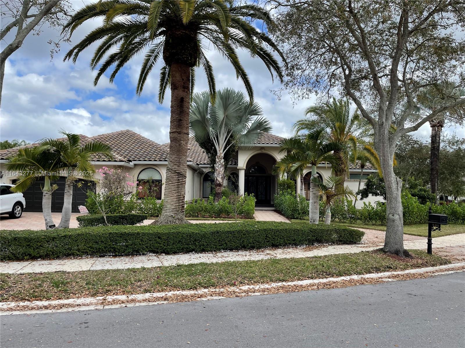 Premium 21,778 sqft Corner Lot, 4,389sqft living space Home featuring a beautifully designed circular driveway and an impressive grand foyer with soaring ceilings.
Recent upgrades include new impact windows, garage door, and front door installed in December 2024, along with a newer roof from 2021.
This spacious residence offers 4 bedrooms, 4 bathrooms, an office, a media room, and a formal dining room.
The interior boasts elegant marble and wood flooring, high ceilings, and crown moldings. Outside, enjoy a screened patio with a waterfall pool, perfect for relaxation.