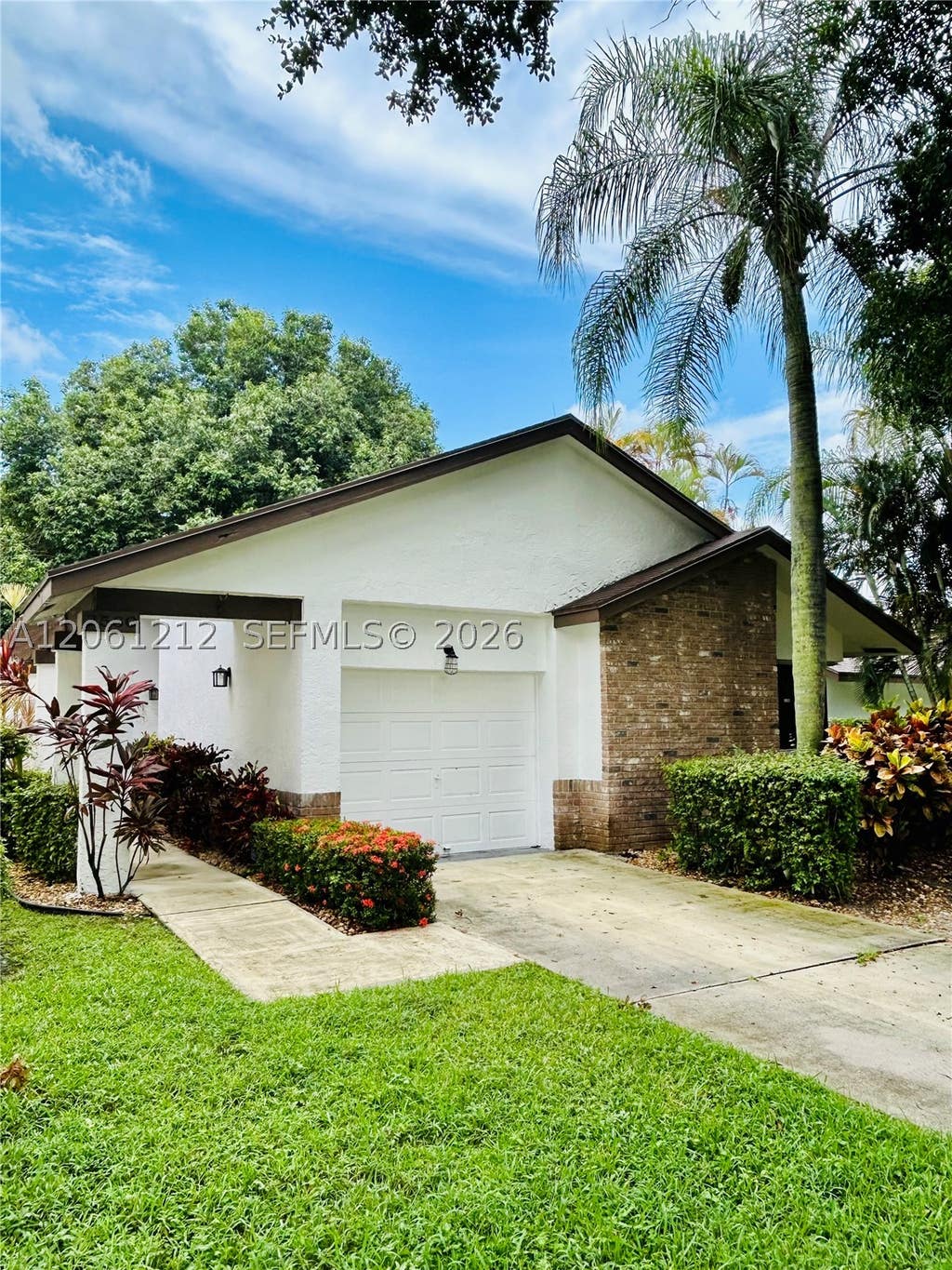 Photo of 2560 Calamondin Cir, Coconut Creek, FL 33063 (MLS # A12061212)