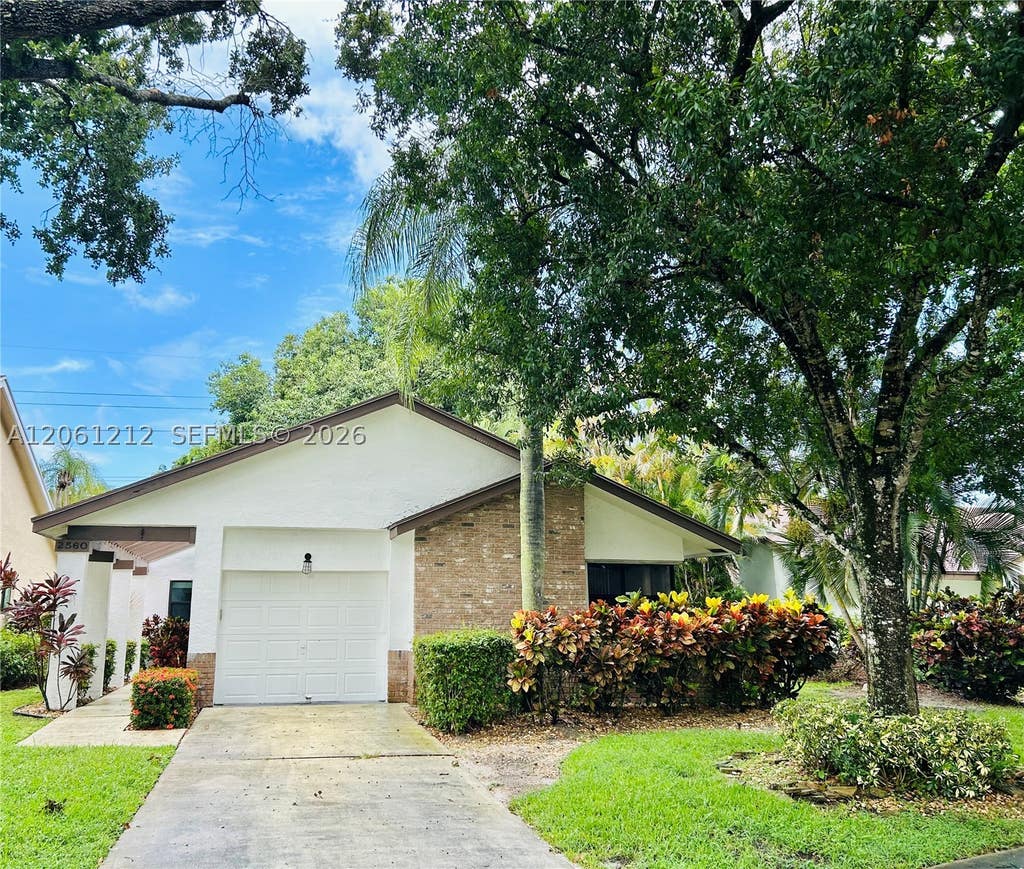Photo of 2560 Calamondin Cir, Coconut Creek, FL 33063 (MLS # A12061212)