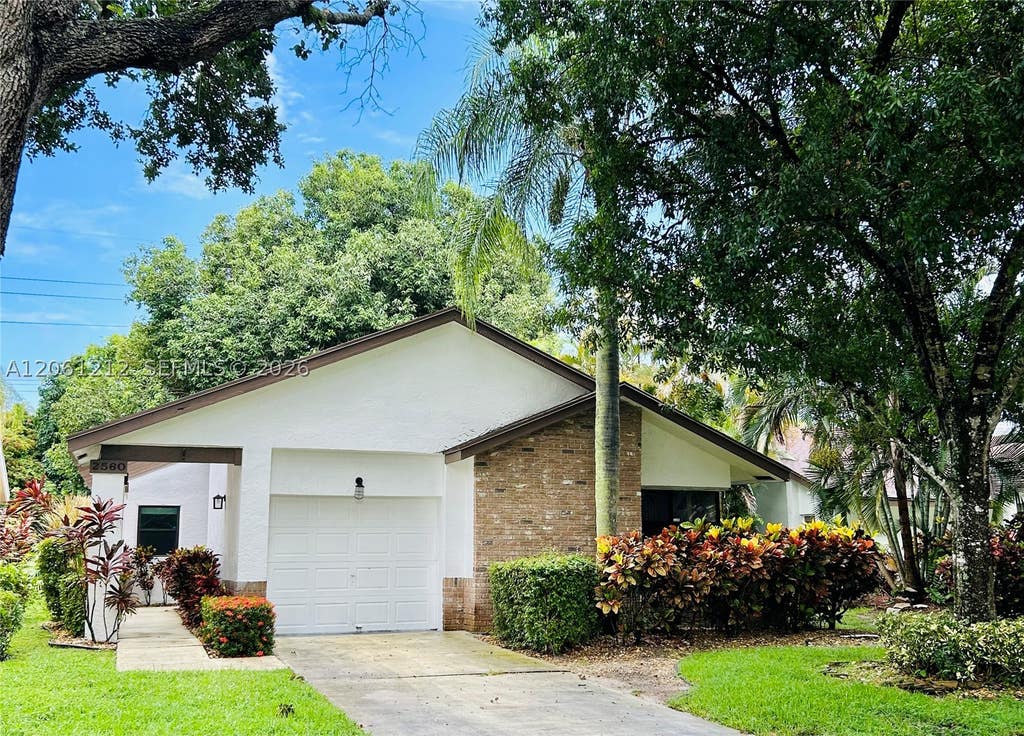 Photo of 2560 Calamondin Cir, Coconut Creek, FL 33063 (MLS # A12061212)