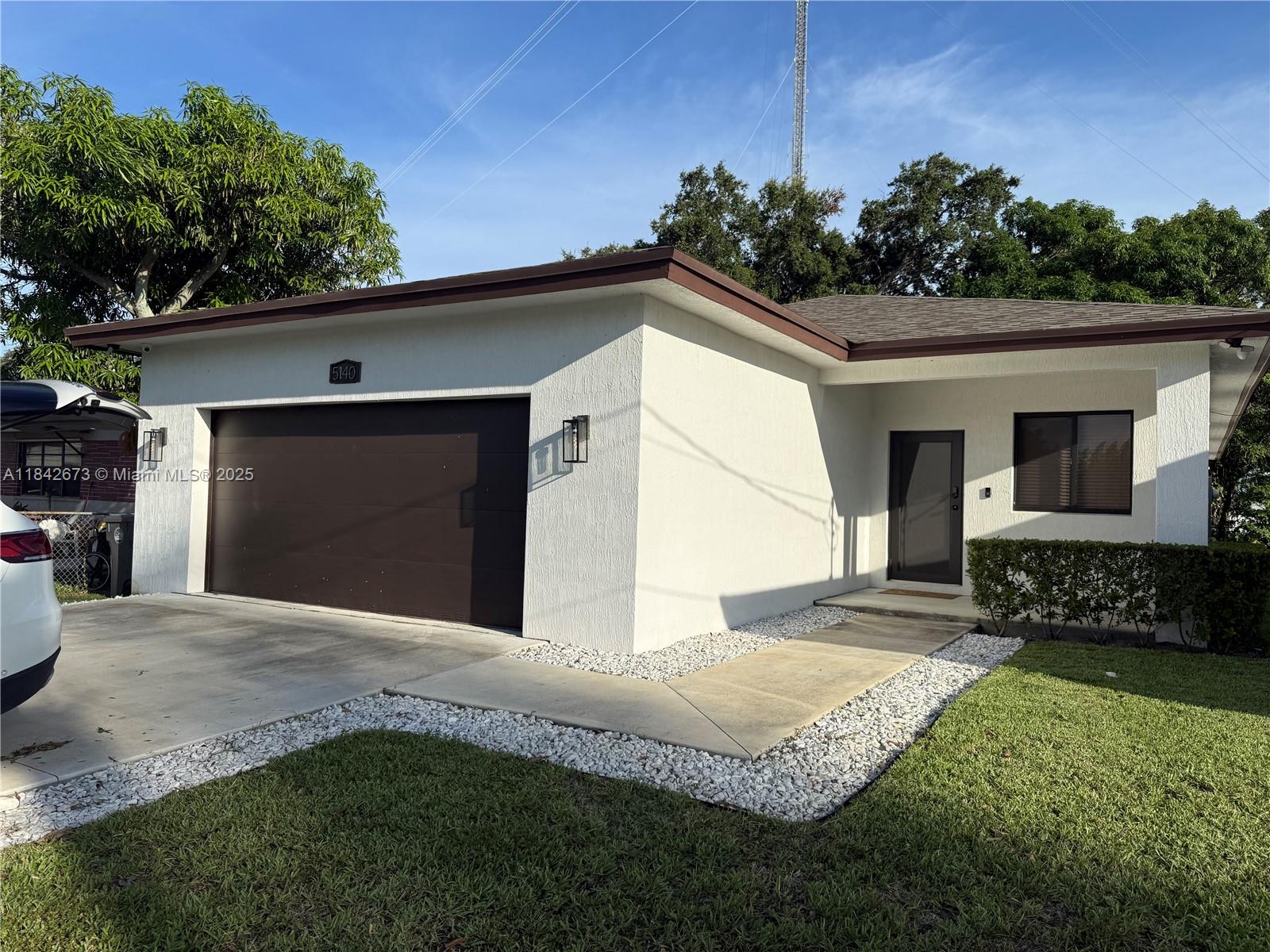 This beautifully maintained 3-bed, 2-bath home has everything you’re looking for! Featuring high ceilings, a spacious open layout, and generously sized bedrooms, it’s perfect for families or anyone who loves to entertain. The 2-car garage plus extra parking in front gives you plenty of room for guests. Built in 2022, the home feels fresh and modern. The backyard is large and private and yes, there’s a mango tree waiting for you to enjoy! Located just minutes from I-95, the Turnpike, and only 15 minutes to Hallandale Beach, this home is centrally located and super convenient for commuting or weekend fun. Don’t miss out this home is move-in ready