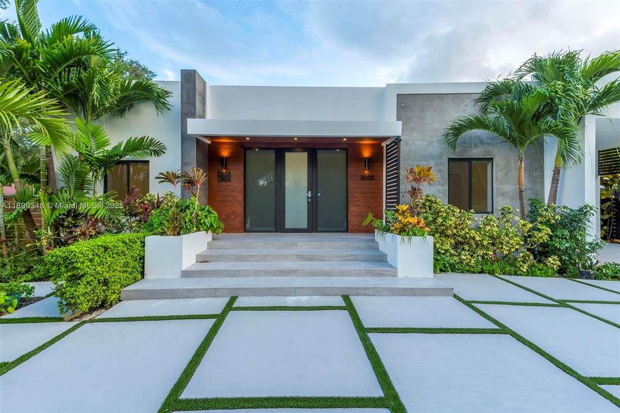 Modern, energy-efficient 5-bed, 4-bath smart home, fully renovated and move-in ready. Close to Coral Gables and minutes from Coconut Grove & Brickell. Open layout, high ceilings, coffee bar, Bosch appliances, wine cooler, quartz countertops. App and Alexa-controlled music, lights, gates, and shades. Luxe primary suite with double vanity, large shower, walk-in closet. One-car garage with EV charger + 4 additional parking spaces. Fenced yard with lush landscaping, artificial grass, saltwater pool, pool shower, and two pergolas. Features include Aquasana water filtration, UV reflective roof, UV-equipped HVAC & garage, and 1200W off-grid solar panels. Includes laundry room, projector & screen, surveillance, and rental-ready efficiency.