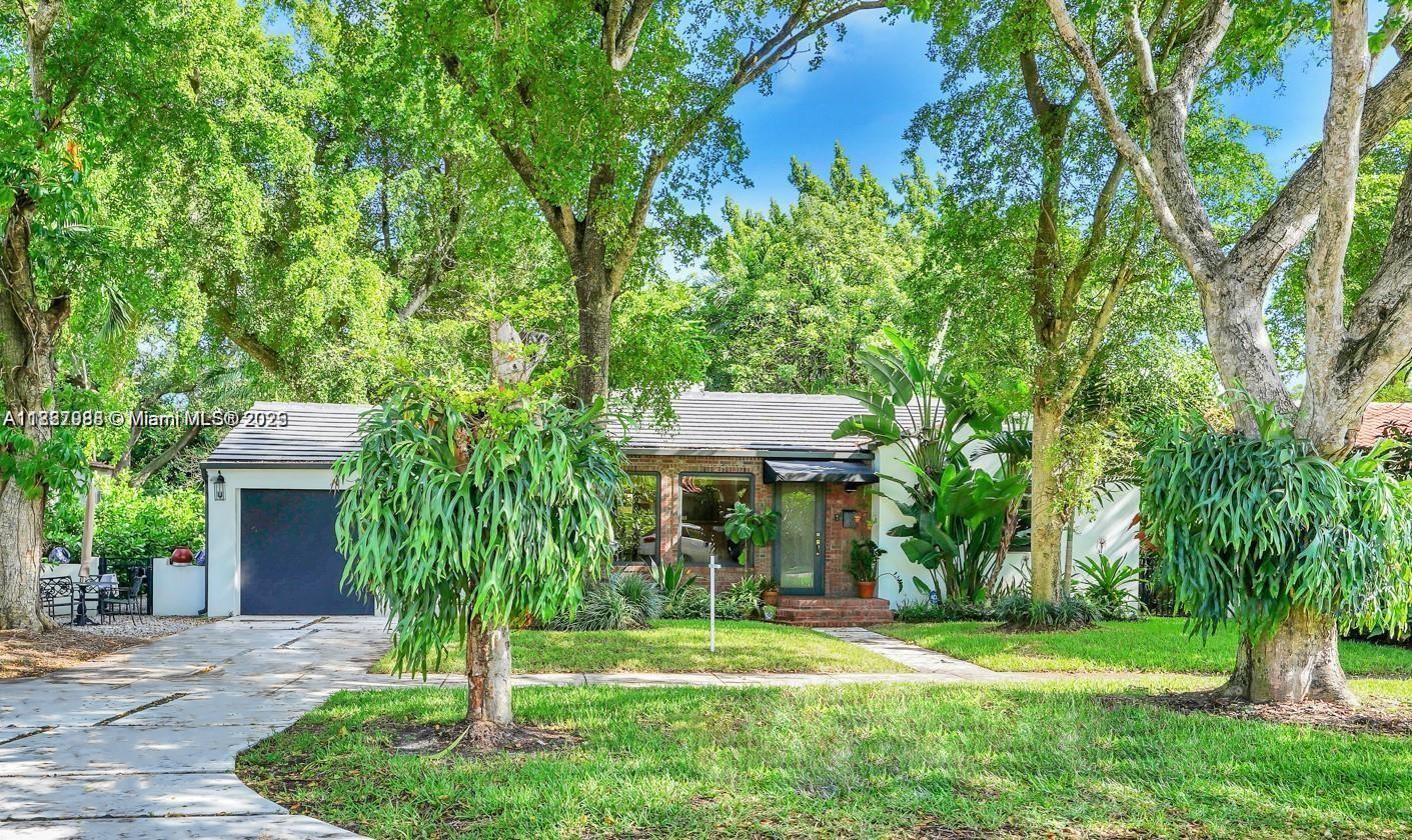 Exceptional Custom HOME completely renovated with attention to details. New Roof, New Air Condition & Ducts. New electrical wiring and plumbing. Fully Remodeled bathrooms and kitchen with wood cabinets, quartz counter tops with stainless steel appliances. impact doors & windows, custom concrete driveway & patio area fenced and gated with outdoor summer kitchen for great family & guess entertaining with luscious landscaping.
Original character to the house includes refurbish hard wood floors with a beautiful & cozy fireplace in living room.