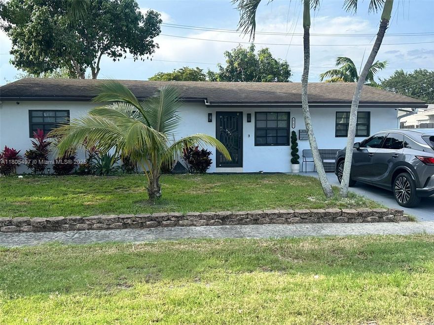 fully renovated house, new impact doors and windows, new kitchen and appliance modern style all paper throughout entire house, sprinkler system with well,