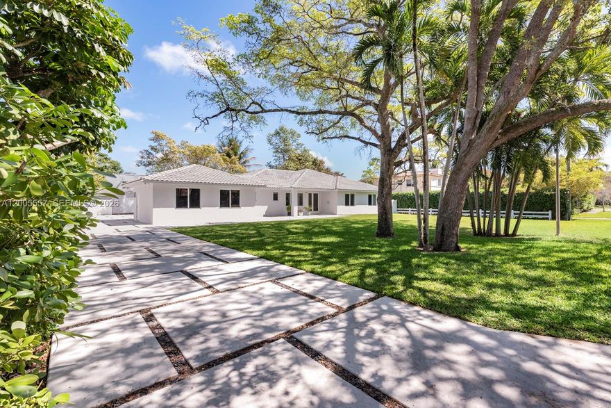 Designed and built by a contractor for himself, this exceptional Biscayne Park
home reflects thoughtful design, premium materials, and timeless quality at
every turn.  Third bedroom currently acting as a den, and requires installation of a door to be a true 3 bedroom.

An inviting open-concept floor plan is enhanced by vaulted ceilings and
abundant natural light, anchored by a beautiful chef’s kitchen with an oversized
center island—ideal for gatherings, entertaining, and daily living.
The home is gracefully set back on a lush, private lot with room to expand,
offering both immediate comfort and long-term flexibility. A versatile third
bedroom currently functions as a den and can be easily converted to a
traditional bedroom. The property is fully fenced, creating a serene and secure
outdoor retreat.

Situated in the prestigious village of Biscayne Park, this home offers a rare
blend of privacy, community charm, and central location just north of downtown
Miami—a true hidden gem for those seeking refined living with urban
convenience.