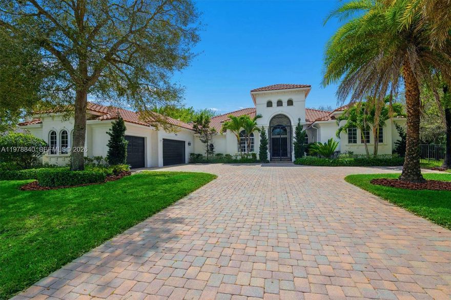 Located in the prestigious enclave of Grand Oak Estates, this residence offers luxurious spaces, architectural distinction, and modern comfort. Enter through elegant iron gates to discover one of only 32 homes in this exclusive community.

The residence spans nearly 6,000 square feet and was originally built in 2007, with an interior refurbish completed in 2016 featuring bespoke Italian design elements. The result is an elegant living environment that blends timeless elements with contemporary style.

The features a great movie room and showcases a gourmet kitchen appointed with premium Viking appliances. Additional features include a private executive office, hurricane-impact windows and doors, a dedicated home theater, and advanced water systems including softening and reverse osmosis filtration.

Outdoor living is ready for relaxation and entertaining, highlighted by a vanishing-edge heated saltwater pool and an expansive patio area with lush trees. A fully equipped summer kitchen, beer tap system, outdoor television, and integrated sound system create a true resort-style experience for everyday living.

Agents please schedule showings through ShowingTime. Buyers interested in viewing the property should contact the listing agents to arrange a private appointment.