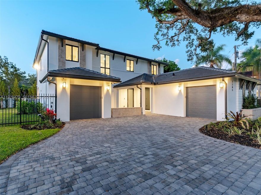 Stunning New Estate in the Gated Community of Pine Rockland Estates with 4,143 SF! Situated on a 14,072 sq. ft. lot, this two-story estate boasts massive entertaining spaces, featuring 4 bedrooms + large den, 3.5 baths, and two 1-car garages. The chef’s kitchen is a showstopper with sleek cabinetry, Wolf/Sub-Zero panel-ready appliances, and a spacious island perfect for entertaining. This home features TWO PRIMARY SUITES one on the first floor and another on the second each designed as a private retreat. The upstairs primary offers a spa-like bathroom with two water closets and two huge walk-in closets. Outdoors, the spacious lot provides plenty of room for a dream backyard oasis whether you’re envisioning a pool, outdoor kitchen, or lush landscaping.