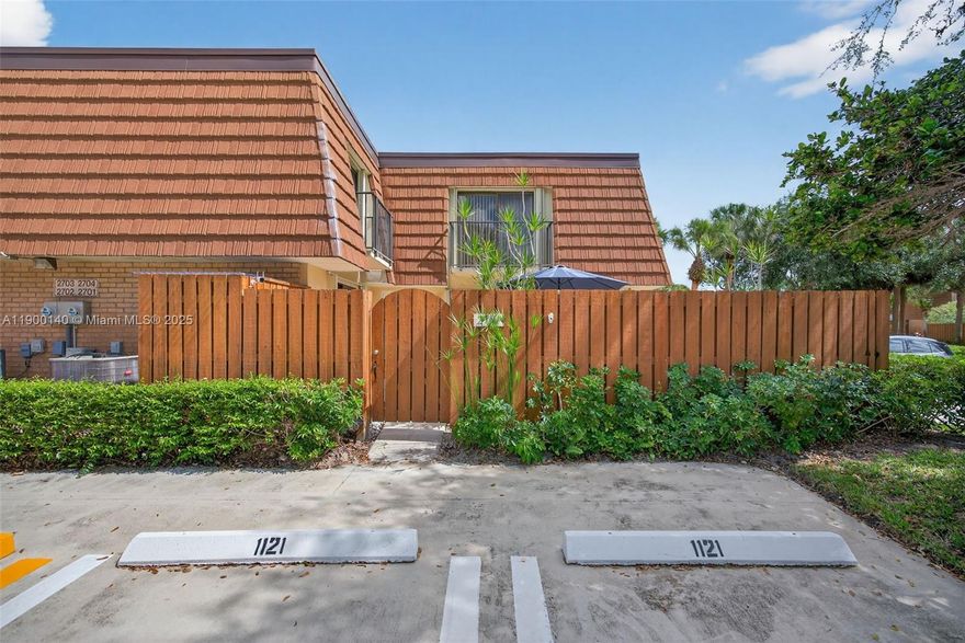 Updated townhome in the Bluffs. Features include wood floors throughout, a white shaker kitchen with granite counters and stainless steel appliances, and an updated half bath with in-unit washer and dryer. The spacious primary suite offers a renovated bath with double vanity, king bed, seamless glass shower, and modern tile. Guest room is en-suite. Private fenced patio with seating and grill—perfect for relaxing or entertaining. Excellent location near shopping, dining, and all that Jupiter has to offer.