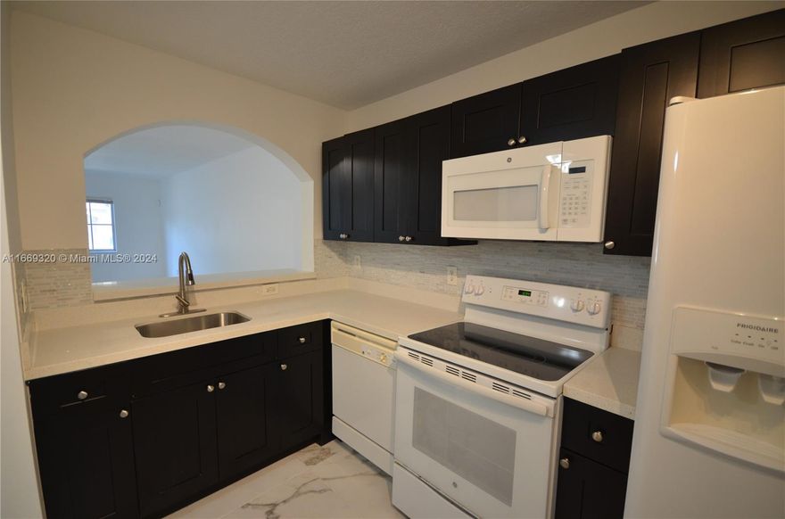 Newly Renovated unit in gated community with 2 bedroom 2 bath. Ceramic tiles throughout with great amenities!  A must see!!!