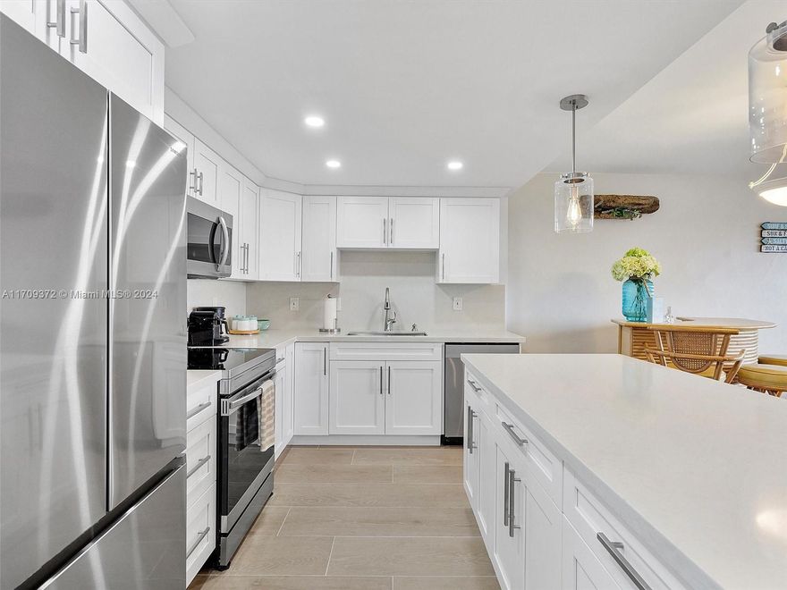 Enjoy breathtaking views of both the ocean and the intracoastal from this bright and airy, fully furnished 1/1/1.Designed for modern living, this home offers an open concept layout with high-end finishes throughout. Walk right outside and onto the popular Hollywood Beach/boardwalk. Gourmet Kitchen that features Stainless steel appliances, center island bar, quartz countertops/backsplash. Wood tile floors throughout and large windows for natural light. Bedroom Features two closets and remote control fans. Bathroom has Double quartz vanity, upgraded tiled shower, and a modern half bath with additional storage. Hurricane Impact Windows. Balcony is Perfect for relaxing and taking in views of the ocean and intracoastal. Great sun exposure.