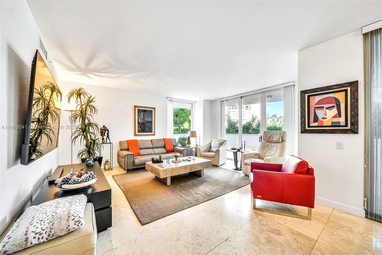 Step into elegance with this rare wraparound-lanai residence (approx. 2,080 SF). A private elevator opens to a double-door foyer, revealing bright, airy interiors in a calm neutral palette. The layout features 2 bedrooms, 2.5 baths, a spacious office/breakfast nook/den, a full laundry room and separate storage unit. The expansive wraparound terrace is perfect for effortless indoor-outdoor living. Retreat to a serene primary suite with a huge custom closet and spa-style bath. Two covered parking options include an assigned space plus complimentary valet. Enjoy resort-style living with a renowned spa, juice bar, state-of-the-art fitness center, tennis courts, BBQ area, playground, three pools, boat services, beauty salon, and more—blending the feel of a private home with five-star amenities.