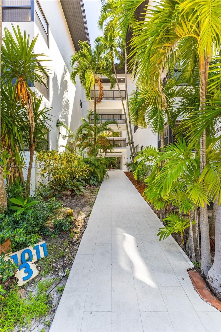 RARE ON THE MARKET!! Discover this spacious and bright 2/2 one-of-a-kind lanai at Ocean Village, Key Biscayne. This unit features a screened and covered private terrace with beautiful pool views, surrounded by lush greenery. The property in perfect condition offers a seamless connection between indoor and outdoor living. The kitchen does not include a stove, oven or countertop. The building has been fully remodeled, and all assessments are paid. Ideally located within walking distance to the beach, shops, and restaurants, this condo truly feels like home.