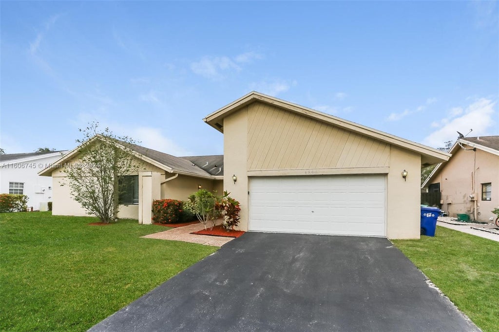 Photo of 4980 NW 73rd Ave, Lauderhill, FL 33319 (MLS # A11606745)