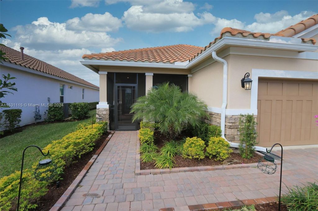 Photo of 9536 SW Royal Poinciana Dr, Port Saint Lucie, FL 34987 (MLS # A11531115)