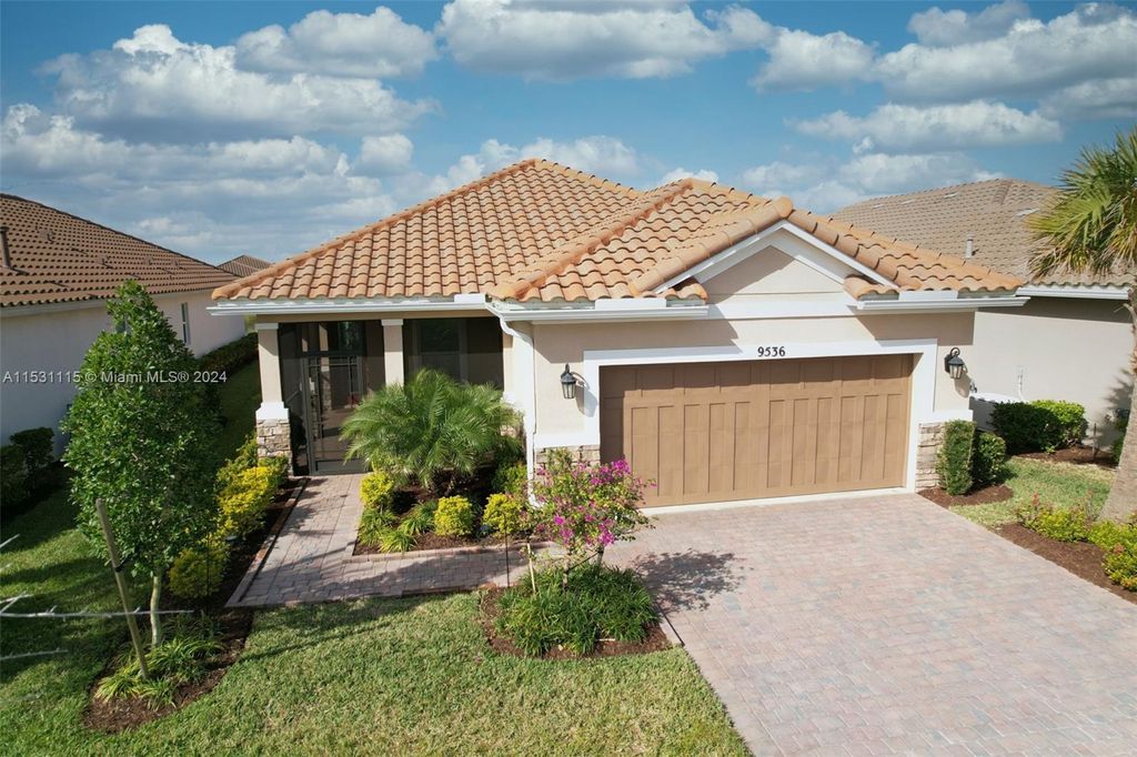 Photo of 9536 SW Royal Poinciana Dr, Port Saint Lucie, FL 34987 (MLS # A11531115)