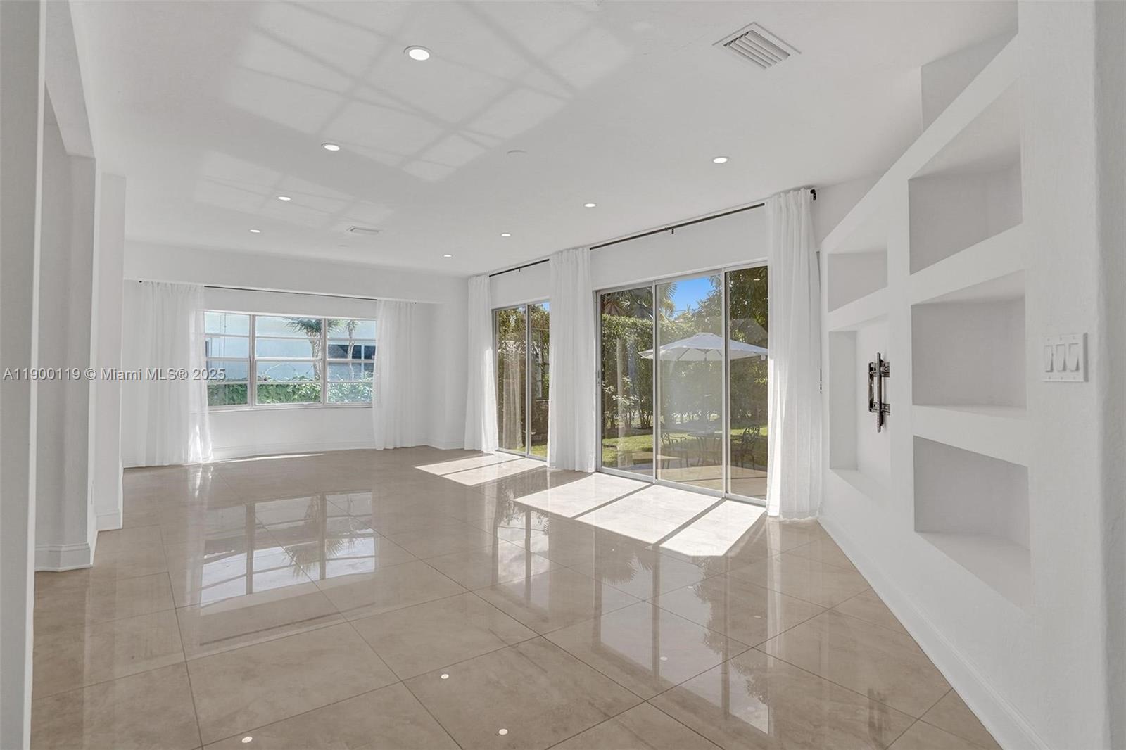 Beautifully renovated! Open and bright space leaving room, looking over an over size yard. All new impact windows and doors. Additional drive way on the back side of the house. Located in a desirable area, one block from South lake, close to the beach, restaurants, Hollywood circle and more. Call to schedule a showing.