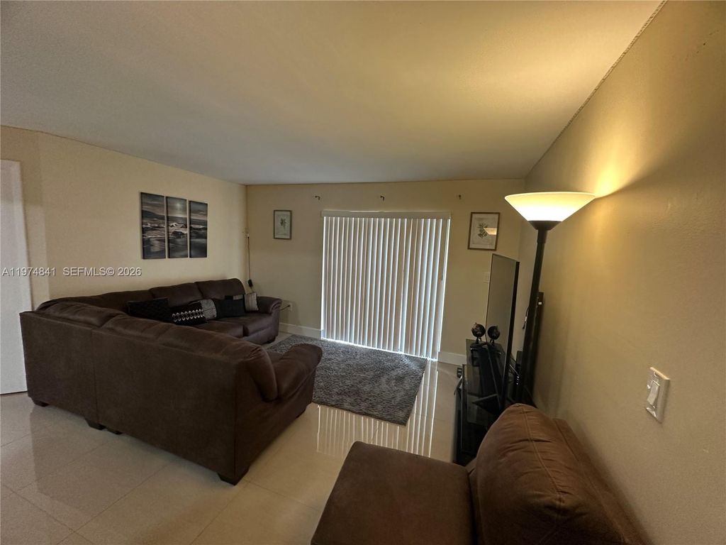 Photo of 9491 S Palm Cir S #202, Pembroke Pines, FL 33025 (MLS # A11974841)