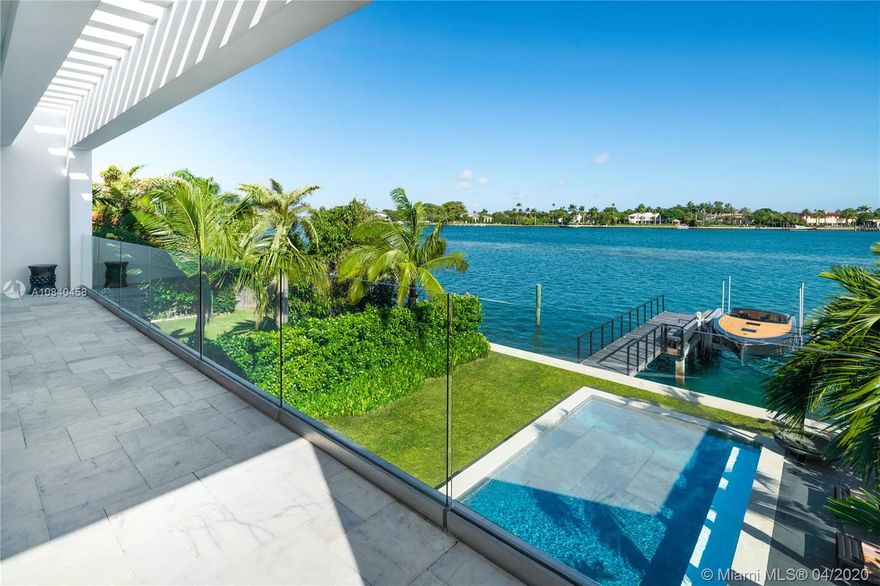 Extraordinary 2017 home with fabulous views of IndianCreek Island and the open bay. Entertainers dream home with high ceilings, pocket sliding glass doors, open format gourmet Italian kitchen, chefs gas range, fire feature below TV & built-in outdoor BBQ pavilion. Impressive Master Suite with sitting room, spa-like freestanding bathtub and all marble shower.  4 bedrooms total each with ensuite luxury bathroom & oversized closets.  1 car garage, motor gate entry & landscaped front courtyard. Carrera marble flooring, flushed high quality doors, w expansive sun terraces on the north & south side for all day sun tanning.  Enjoy sunsets daily from the beautiful Brazilian Ipe wood dock off the sun-flooded oversized pool. Boat lift included. Within private, 24HR guard-gated Stillwater​​‌​​​​‌​‌​​​‌‌​​​‌‌‌​​‌​​‌‌​​​​ community.