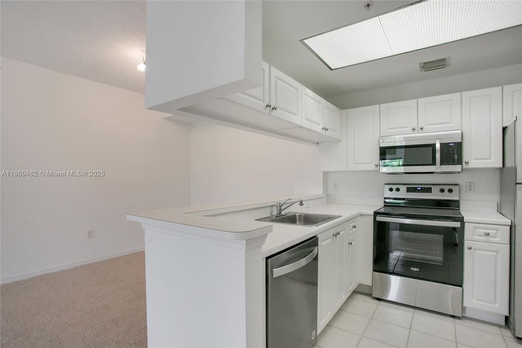 Photo of 2813 Grande Pkwy #301, Palm Beach Gardens, FL 33410 (MLS # A11860482)