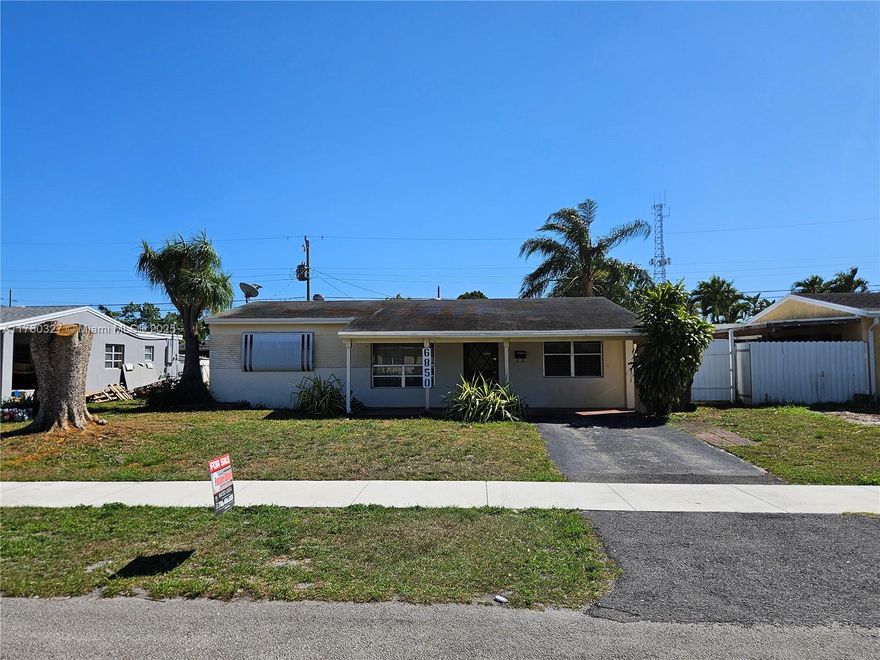 PRICE IMPROVED!! Great starter home with a large, fenced back yard. Single Family Home with 4 Large Bedrooms / 2 Bathrooms and NO ASSOCIATION. Property could be easily divided into 2 units for additional income. This home boasts 1,680 square feet of living area along with an updated bathroom, Central AC unit is 3 years old, updated drain field system, Security Alarm System, Sprinkler system on Timer, Upgraded Electrical System. The house needs some renovations. Located minutes away from 595, I-95, & the Turnpike. Conveniently located 2 blocks from Elementary and Middle Schools, near the Hard Rock Guitar Hotel, shops & restaurants. FHA contracts OK. PREFERRED LENDER OFFERS 2% INTEREST RATE REDUCTION. SELLER MOTIVATED.