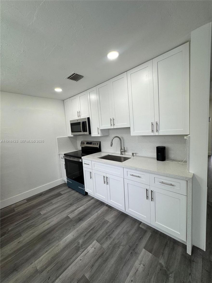 QUICK MOVE...completely upgraded with.location location.. walking distance to Nova Schools, and Colleges. Minutes from all major highways, Hard Rock Casino, Davie Rodeo, FTL Airport, Sawgrass Mills Mall, and the beaches. NO HOA,MODERN KITCHEN,APPLIANCES,  SPACIOUS LAUNDRY ROOM, WASHER AND DRYER INSIDE. CENTRAL A/C