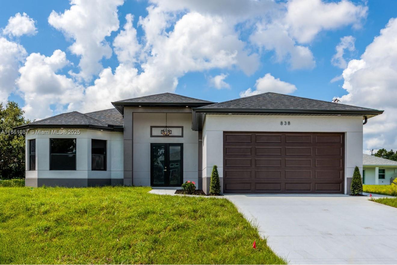 *** New Construction Home*** Must See*** READY to MOVE IN. Beautiful 4 bedroom 2 bathroom home, located in a fast growing area in Lehigh Acres set on a lovely 0.25-acre lot, there’s plenty of outdoor space to enjoy. This home has an Modern OPEN floor plan, high ceilings, beautifully 24x48 porcelain tile floors throughout the entire home, stainless steel appliances, IMPACT WINDOWS and doors. Schedule your showing today and come see this beautiful home!